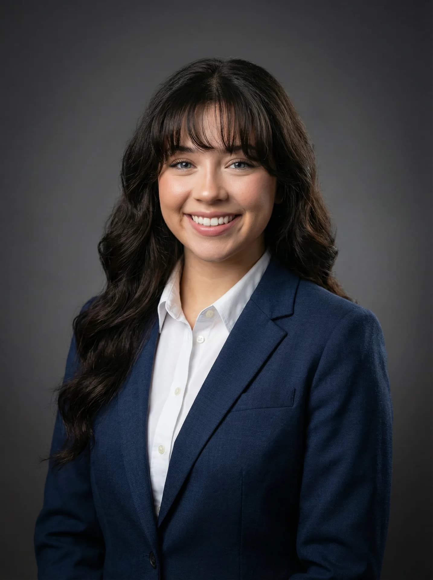 Professional headshot of the synthetic woman in a navy business suit