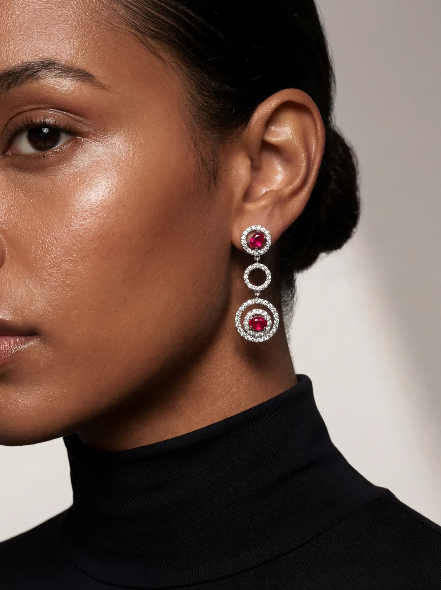 Photorealistic close-up of a tiered earring on a woman's ear